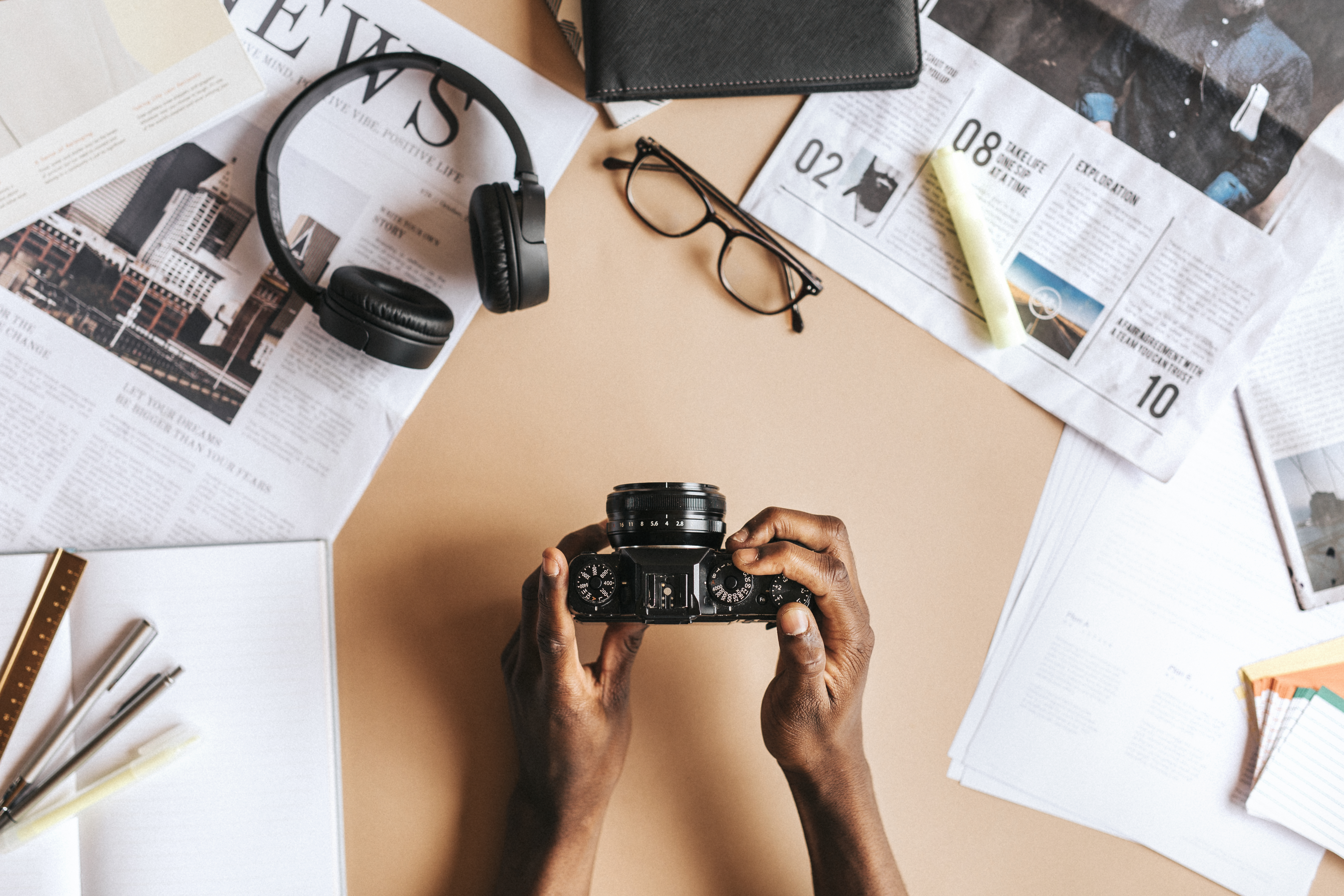 Black man using an analog camera