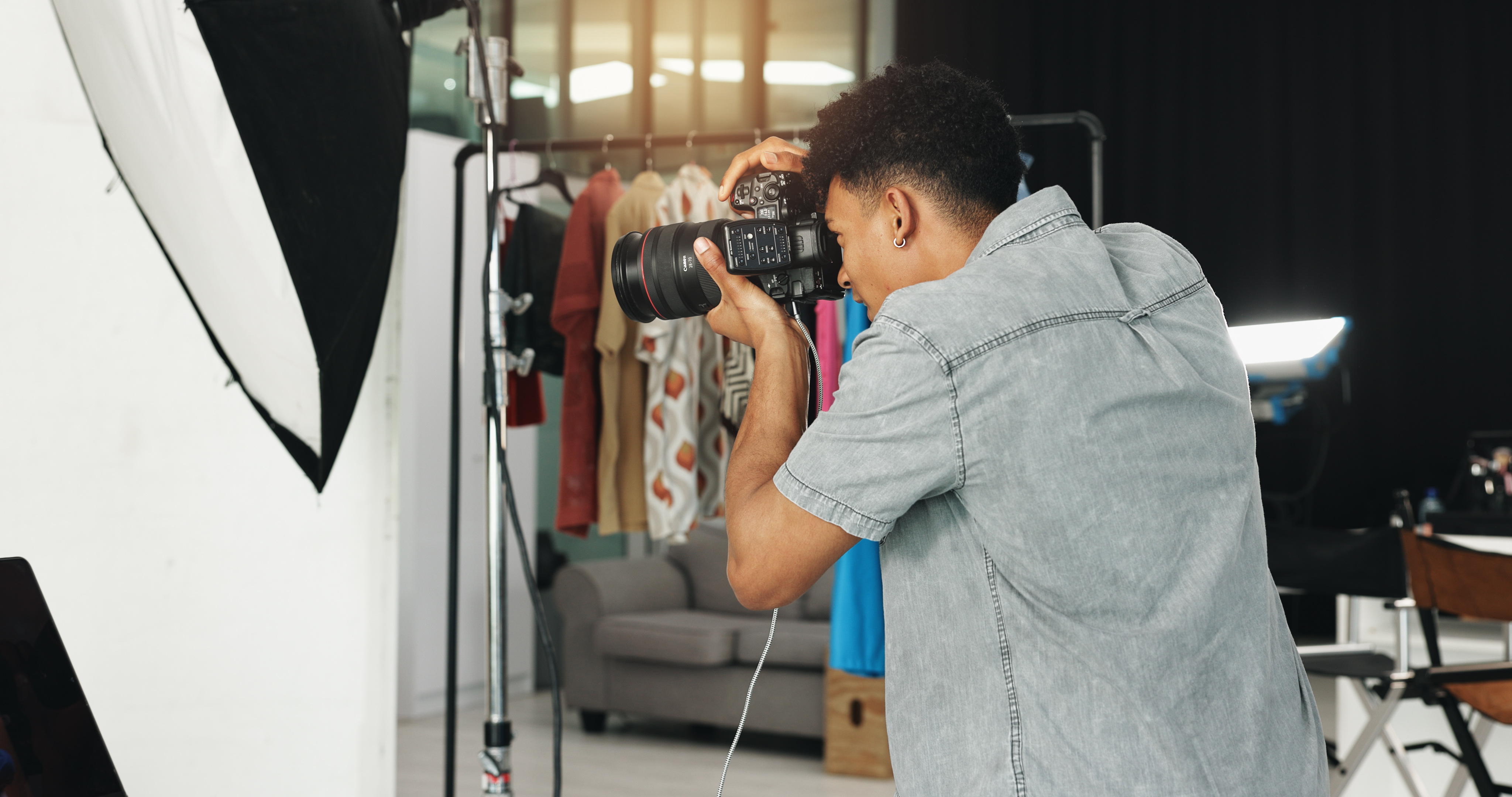 Photography, fashion and creative with man in studio for magazine production, backstage and wardrob.